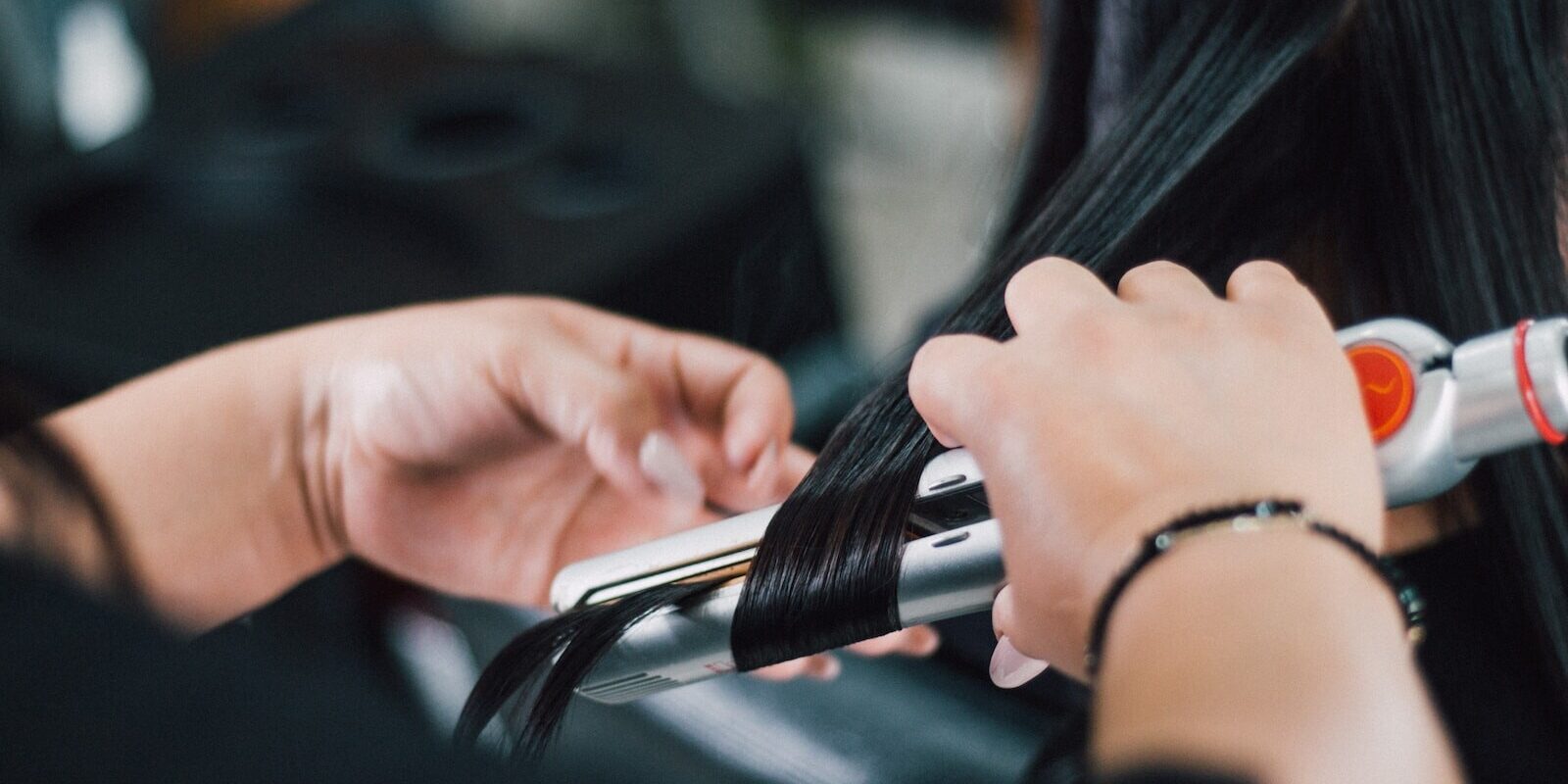 person holding black and silver hand tool